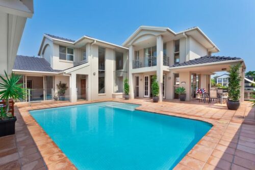 A mansion with a pool